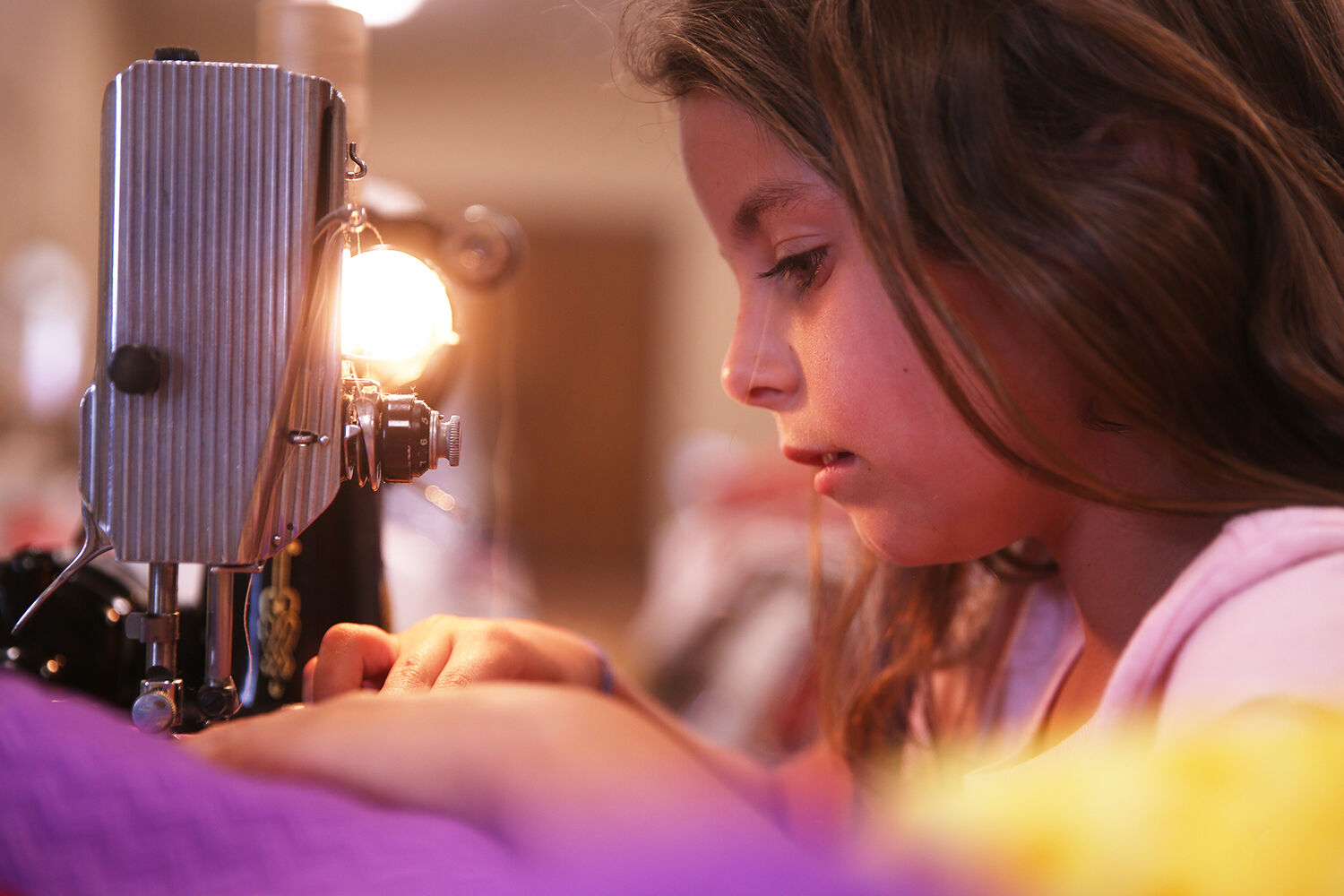 Brooke Chapman, 8, attentively watches her seem lines